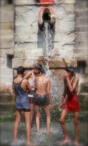 Children bathing in the pure & perennial stream - Gomukh by Adityavikram More